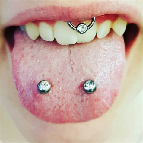 spider bite piercings|split tongue with venom piercing.